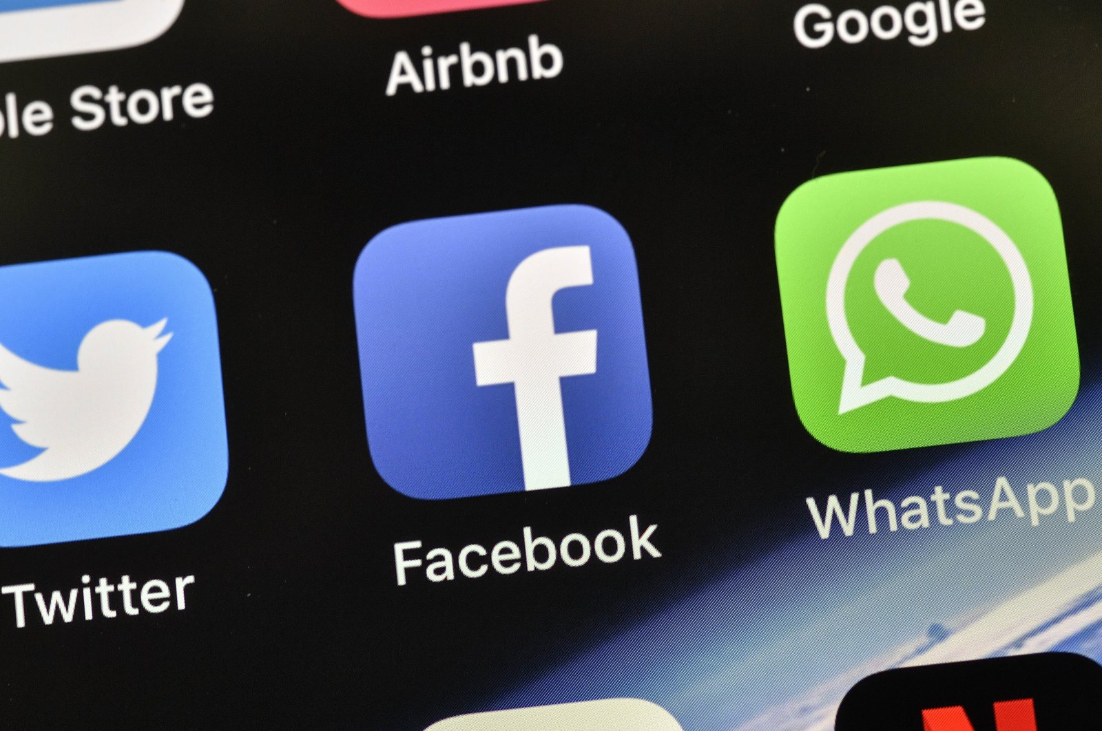 The icons of Facebook and WhatsApp are pictured on a phone in Gelsenkirchen, Germany, Nov. 15, 2018. (AP Photo)