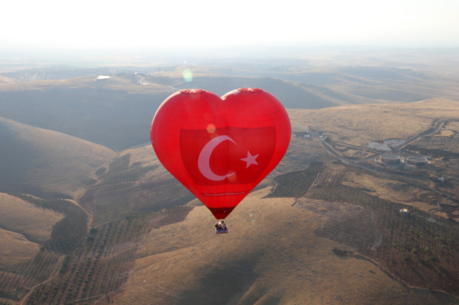 The first balloons of the season take off near the ancient site of Göbeklitepe in Şanlıurfa province, southeastern Turkey, July 12, 2021. (AA Photo)
