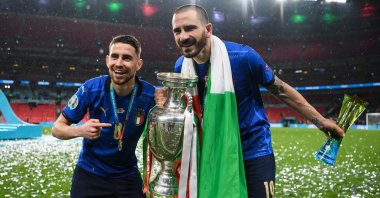 Italy's Jorginho and Leonardo Bonucci celebrate with the trophy after beating England in the Euro 2020 final at Wembley, London, England, July 11, 2021. (AA Photo)