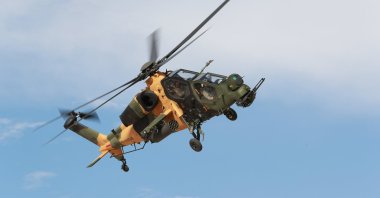 A TAI-made ATAK helicopter is seen flying in the sky in this photo provided on July 13, 2021. (IHA Photo)