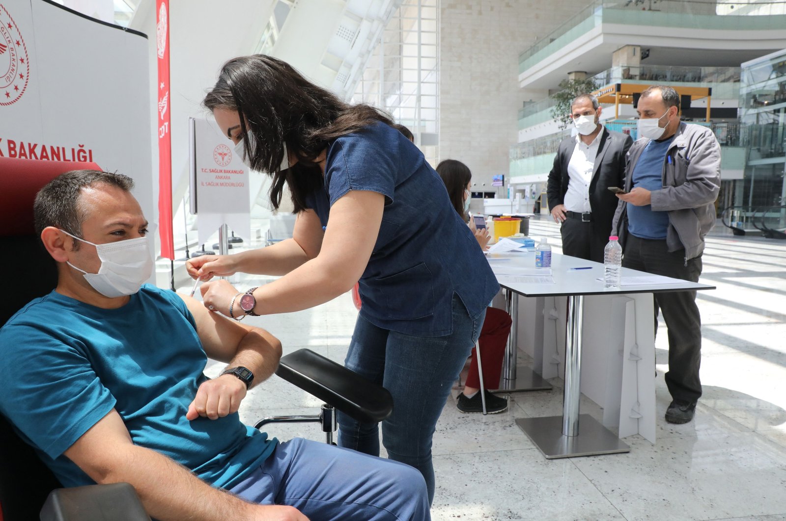 A man receives a dose of a COVID-19 vaccine at a vaccination center set up at Ankara High-Speed Train Station, June 28, 2021, Ankara, Turkey. (AFP Photo)