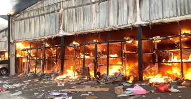 A fire engulfs Campsdrift Park, which houses Makro and China Mall, following protests that have widened into looting in Pietermaritzburg, South Africa, July 13, 2021, in this screen grab taken from a video obtained from social media. (Courtesy Sibonelo Zungu via Reuters)