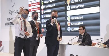 Fenerbahçe managing committee member Selahattin Baki (L), Galatasaray's Şükrü Haneda (2nd L) and Beşiktaş's Kemal Erdoğan attends the fixture draw for the 2021/22 Turkish Süper Lig season at the TFF headquarters at Riva, Istanbul, Turkey, July 13, 2021. (AA Photo)