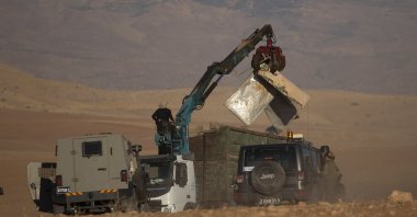Israeli forces demolish tents and other structures belonging to Bedouins at the Khirbet Humsu hamlet in Jordan Valley in the West Bank, Wednesday, July 7, 2021. (AP Photo)