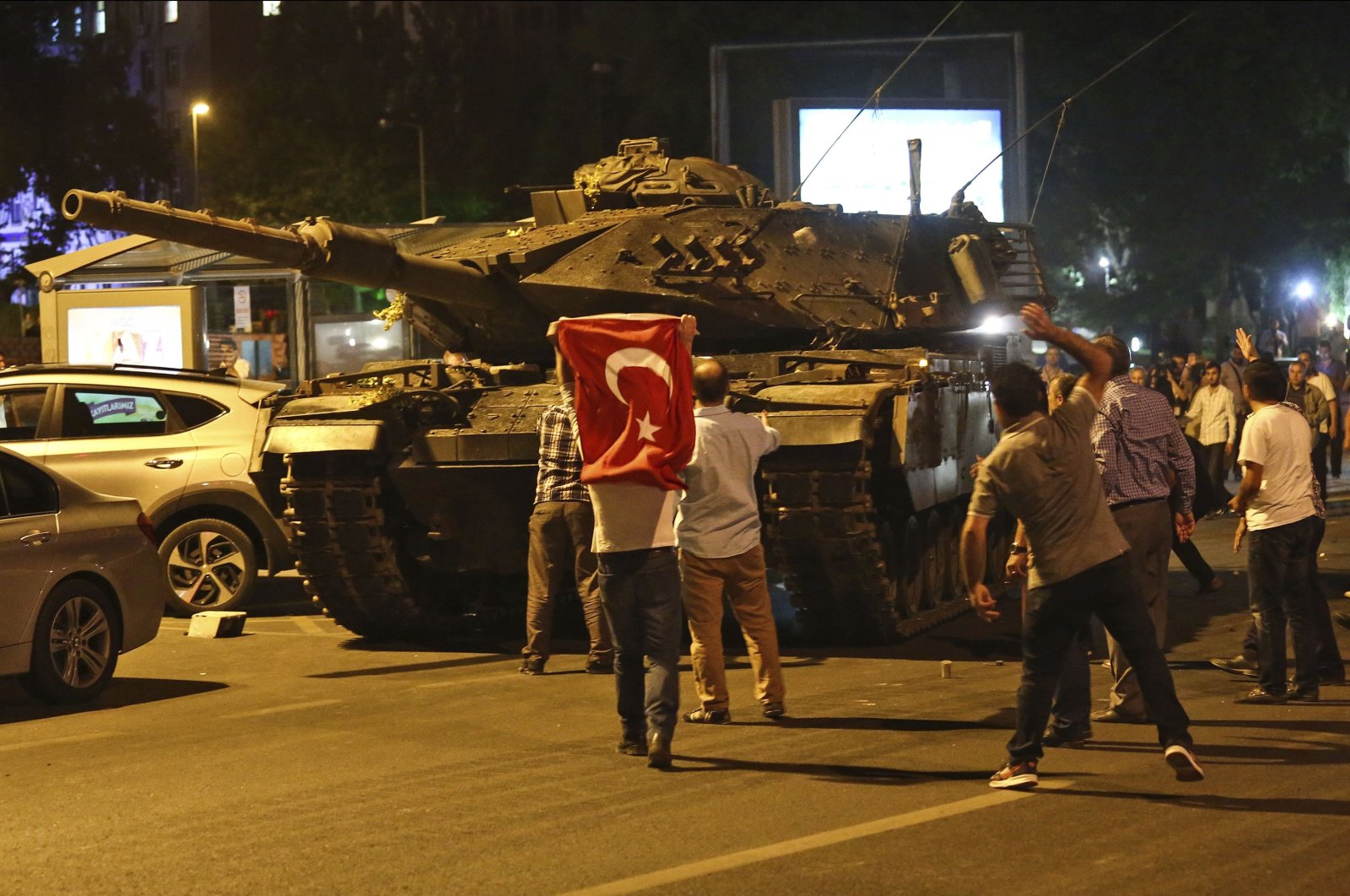 Tanks, part of the forces that attempted a coup, move into position as people attempt to stop them, in Ankara, Turkey, July 16, 2016. (AP Photo)