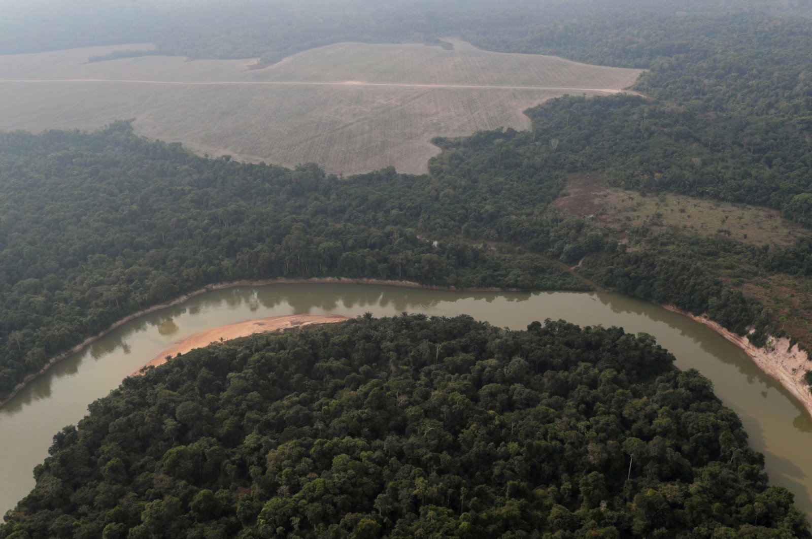 An aerial view of the Amazon forest shows a river and a deforested plot near Porto Velho, Rondonia State, Brazil, Aug. 14, 2020. (Reuters Photo)