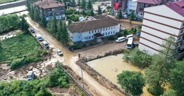 A view of Güneysu district with roads filled with debris and floodwaters, in Rize, northern Turkey, July 15, 2021. (AA Photo)