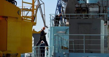 Workers seen as they work on the deck of Russia's nuclear-powered icebreaker Sibir during construction at the Baltic Shipyard in Saint-Petersburg, Russia, July 5, 2021. (AFP Photo)