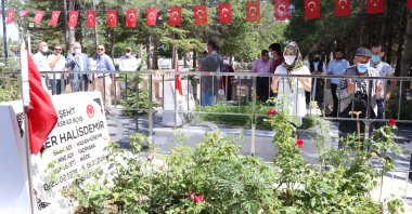 People pray by the graveside of Ömer Halisdemir, in Niğde, central Turkey, July 15, 2021. (AA PHOTO) 