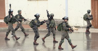 Israeli soldiers patrol a street near the city Nablus in the occupied West Bank, April 10, 2020.  (Getty Images)