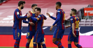 Barcelona's Lionel Messi celebrates with teammates scoring the opening goal during the Spanish La Liga match against Celta at the Camp Nou, Barcelona, Spain, May. 16, 2021. (AP Photo)
