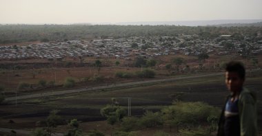 A boy stands on a hill facing Mai Aini Eritrean Refugee camp near Mai Tsberi town in Tigray Region, Ethiopia, June 27, 2021. (Reuters Photo)