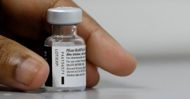 A medical worker prepares to dilute a vial of Pfizer-BioNTech's COVID-19 vaccine at a vaccination center in Singapore, March 8, 2021. (Reuters Photo)