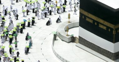 Muslim pilgrims circumambulate the Kaaba as they wear masks and keep social distancing, a day before the annual hajj pilgrimage, Mecca, Saudi Arabia, Saturday, July 17, 2021. (AP Photo/Amr Nabil)