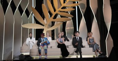 Jury members Tahar Rahim, from back left, Jessica Hausner, Kleber Mendonca Filho, Mylene Farmer, Spike Lee, from bottom left, Melanie Laurent, Song Kang-ho, and Mati Diop appear during the awards ceremony at the 74th international film festival, Cannes, southern France, July 17, 2021. (AP Photo)