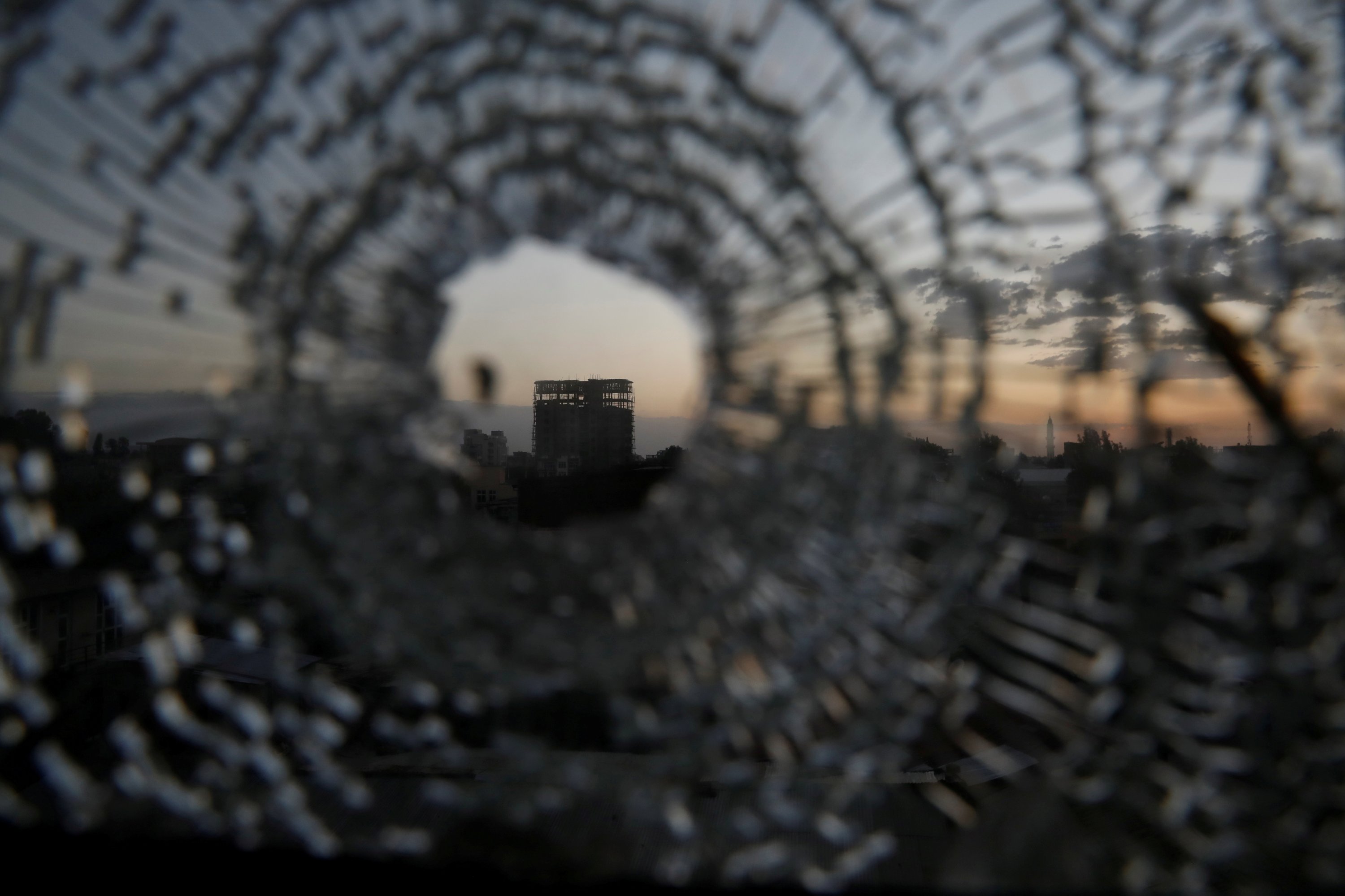 A building is seen through a bullet hole in a window of the Africa Hotel in the town of Shire, Tigray region, Ethiopia, March 16, 2021. (Reuters Photo)