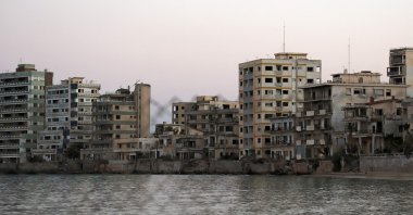 A view shows abandoned buildings and hotels in the fenced-off area of Varosha in the town of Famagusta in the Turkish Republic of Northern Cyprus (TRNC) of the divided Mediterranean island of Cyprus, July 16, 2021. (AFP Photo)