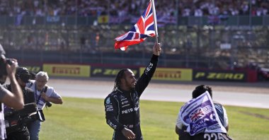 Mercedes driver Lewis Hamilton of Britain celebrates after winning the British Formula One Grand Prix, at the Silverstone circuit, in Silverstone, England, Sunday, July 18, 2021. (Lars Baron/Pool photo via AP)