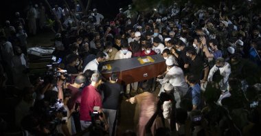 People carry the coffin of Reuters photographer Danish Siddiqui during his funeral in New Delhi, India, July 18, 2021. (AP Photo)
