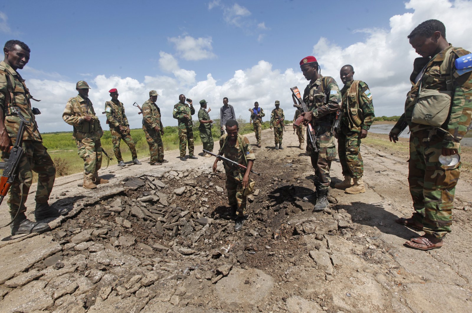 Somali soldiers stand at a Somali military base, near the site of an attack by al-Shabab in which a US soldier was killed and four others were injured in Somalia, Wednesday, June 13, 2018. (AP Photo/Farah Abdi Warsameh, File)