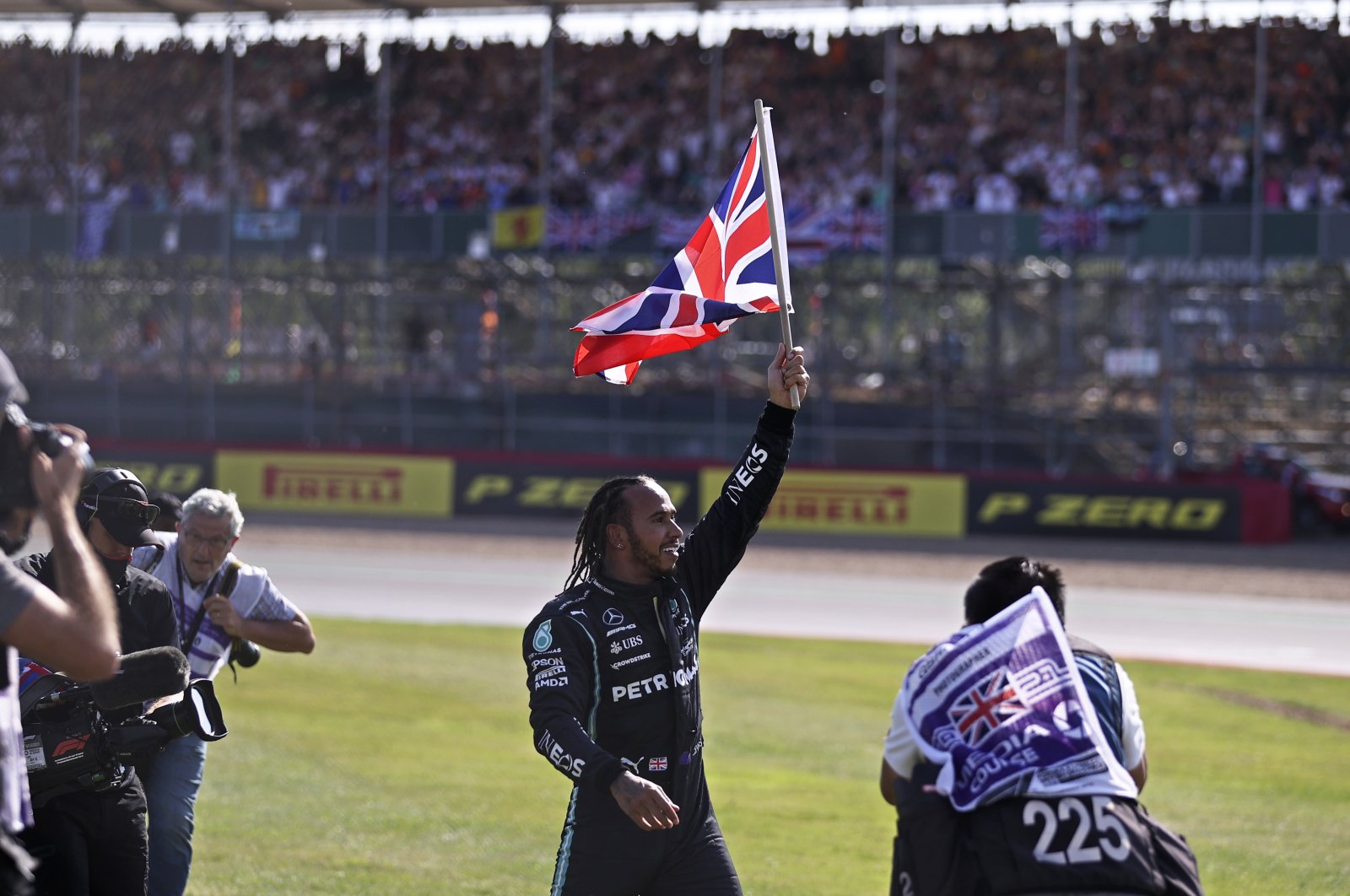 Mercedes driver Lewis Hamilton of Britain celebrates after winning the British Formula One Grand Prix, at the Silverstone circuit, in Silverstone, England, Sunday, July 18, 2021. (Lars Baron/Pool photo via AP)
