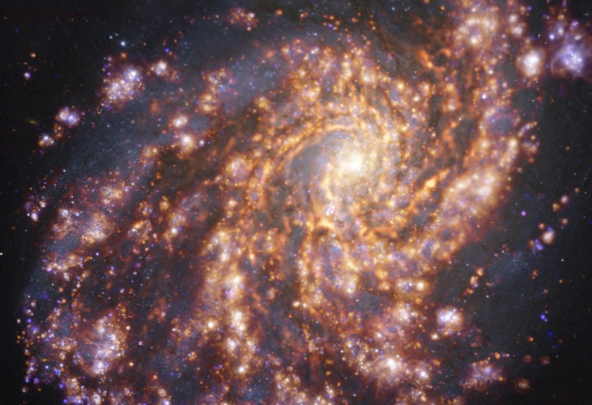 This image made available by the European Southern Observatory on July 16, 2021, and taken as part of the Physics at High Angular resolution in Nearby GalaxieS (PHANGS) project, which is making high-resolution observations of nearby galaxies with telescopes operating across the electromagnetic spectrum, shows the nearby galaxy NGC 4254,  obtained by combining observations taken with the Multi-Unit Spectroscopic Explorer (MUSE) on the ESO Very Large Telescope and with the Atacama Large Millimeter/submillimeter Array (ALMA), in which ESO is a partner.  (Photo by Handout / European Southern Observatory via AFP)