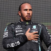 Race winner Mercedes' British driver Lewis Hamilton on the podium after the Formula One British Grand Prix motor race at Silverstone motor racing circuit in Silverstone, central England on July 18, 2021. (Photo by LARS BARON / various sources / AFP)