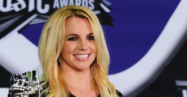 In this file photo Britney Spears holds her Best Pop Video Award and her Michael Jackson Video Vanguard Award in the press room at the 2011 MTV Video Music Awards (VMAs) August 28, 2011 at the Noika Theatre in downtown Los Angeles, California. (AFP Photo)