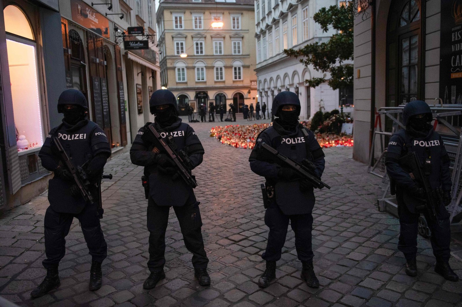 Armed police officers stand guard before the arrival of Austrian Chancellor Kurz and European Council President Charles Michel for a visit to pay respects to the victims of the terrorist attack in Vienna, Austria, Nov. 9, 2020. (AFP Photo)