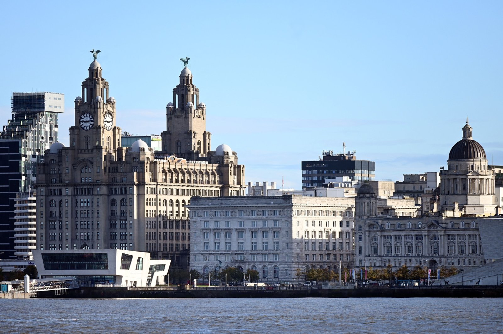 Buildings on Liverpool's waterfront, including the Liver Building, are pictured across the River Mersey, Liverpool, Britain, Oct. 12, 2020. (AFP Photo)