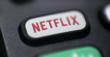 A logo for Netflix can be seen on a remote control in Portland, Oregon, U.S., Aug. 13, 2020. (AP Photo)