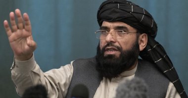 Suhail Shaheen, Afghan Taliban spokesperson and a member of the negotiation team gestures while speaking during a joint news conference in Moscow, Russia, March 19, 2021. (AP Photo)