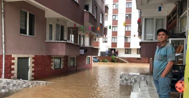 A man looks at the flooded street in the Fındıklı district, in Rize, northern Turkey, July 22, 2021. (AA PHOTO)