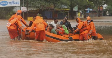 National Disaster Response Force personnel rescue people stranded in floodwaters in Kolhapur, in the western Indian state of Maharashtra, July 23, 2021. (AP Photo)
