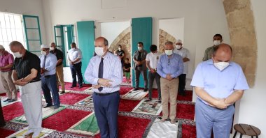 TRNC President Tatar (C), other officials and Cypriots attend the Friday prayers at the Bilal Ağa Masjid in Northern Cyprus on July 23, 2021. (AA Photo)