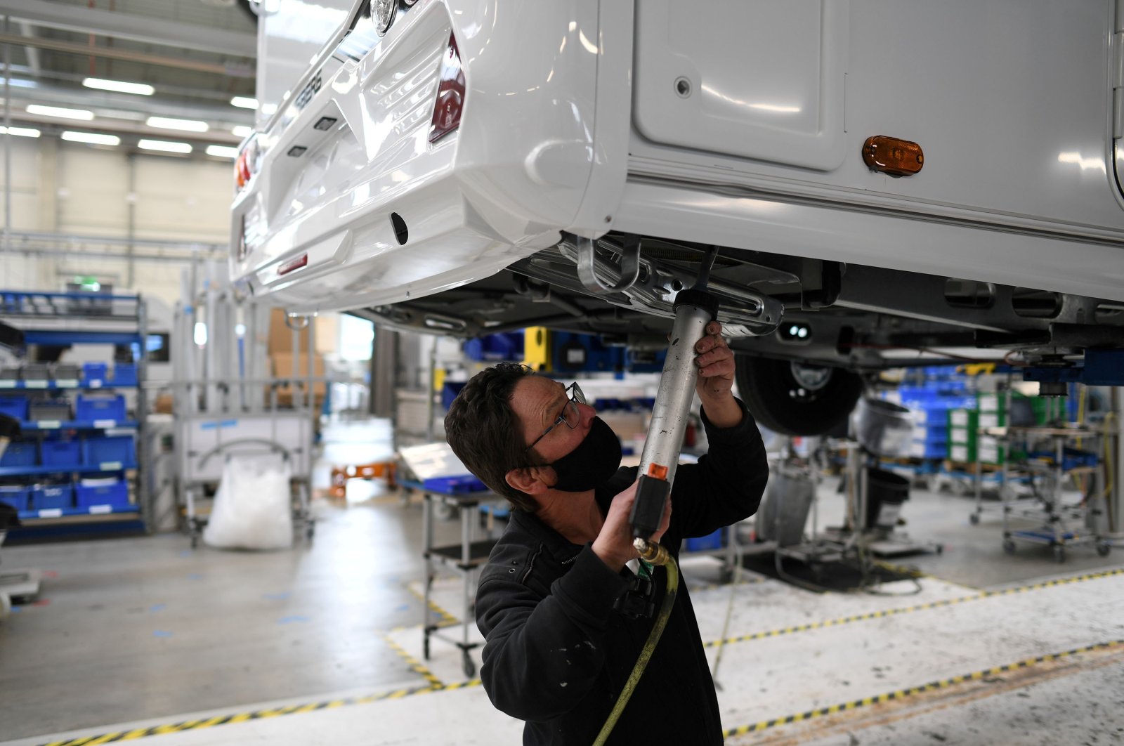 A worker assembles a vehicle at the Knaus-Tabbert AG factory in Jandelsbrunn near Passau, Germany, March 16, 2021. (Reuters Photo)