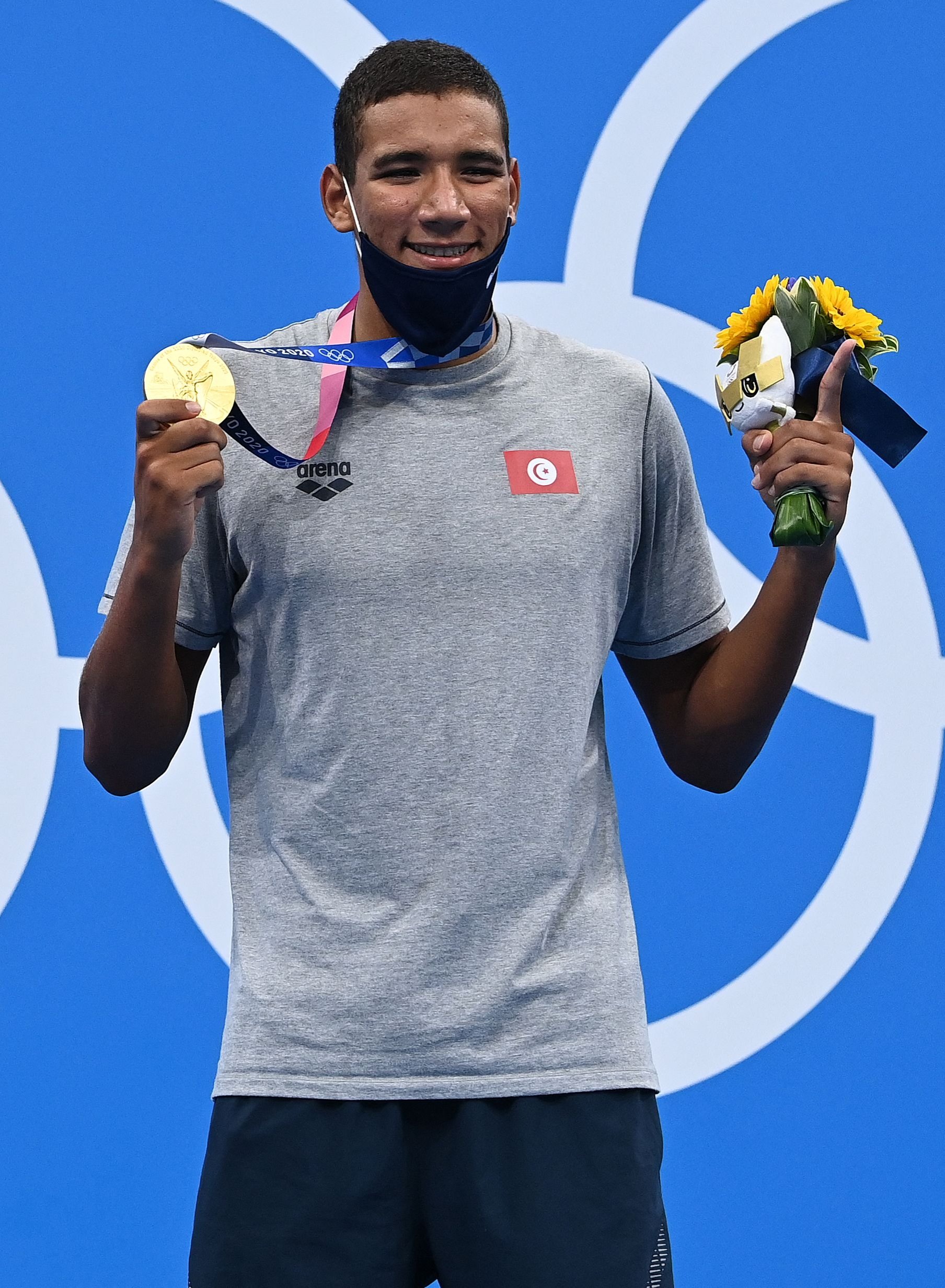 Gold medalist Tunisia's Ahmed Hafnaoui poses with his medal after the final of the men's 400m freestyle swimming event during the Tokyo 2020 Olympic Games at the Tokyo Aquatics Centre in Tokyo, Japan, July 25, 2021. (AFP Photo)