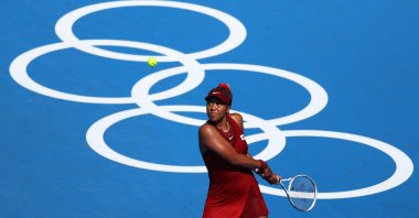 Japan's Naomi Osaka in action during her Tokyo Olympics first-round match against China's Zheng Saisai, Ariake Tennis Park, Tokyo, Japan, July 25, 2021. (Reuters Photo)