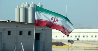 This file photo taken on November 10, 2019, shows an Iranian flag at Iran's Bushehr nuclear power plant, during an official ceremony to kick-start work on a second reactor at the facility. (AFP Photo)