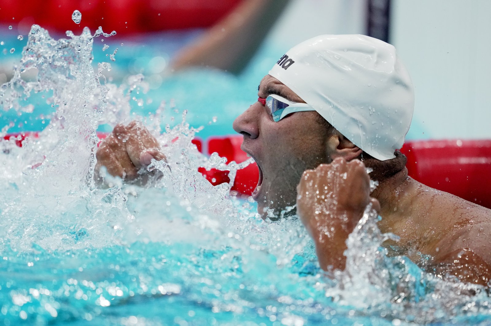 Tunisia's Ahmed Hafnaoui reacts after winning gold in Tokyo 2020 Olympics Men's 400-meter Freestyle, Tokyo, Japan - July 25, 2021. 