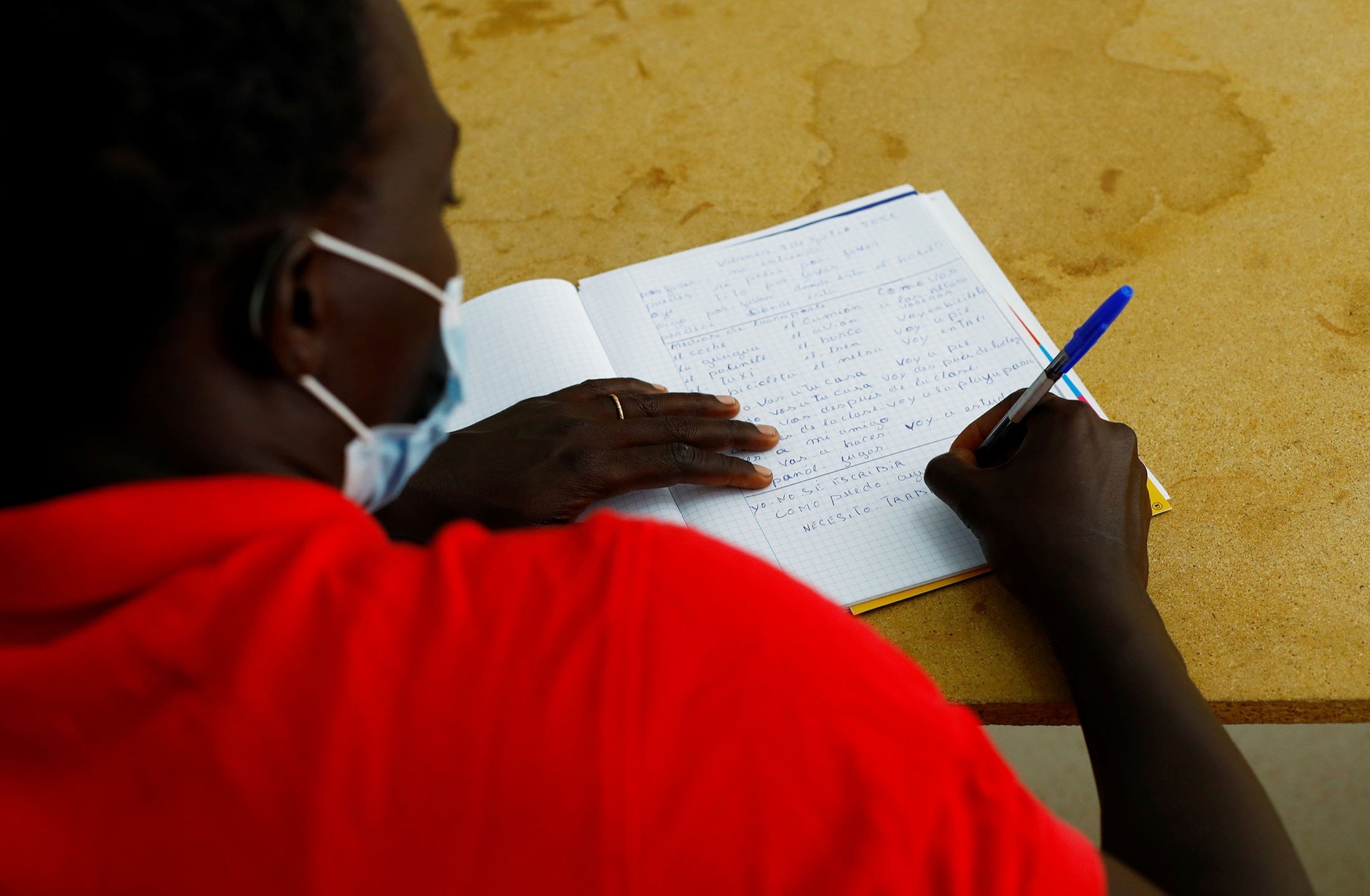 Gorgui Mbengue, a migrant from Senegal, receives Spanish lessons in Tito Martin