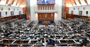 A special session of the Dewan Rakyat (House of Representatives) at the Parliament in Kuala Lumpur, convening for the first time since January after being suspended under a coronavirus emergency, July 26, 2021. (Photo by Nazri RAPAAI / Malaysia's Department of Information / AFP)