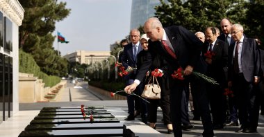 Turkey's ruling Justice and Development Party (AK Party) Deputy Chair Numan Kurtulmuş and his delegation visit the Baku Martyrs' Lane in the capital Baku, Azerbaijan, July 26, 2021. (AA Photo)