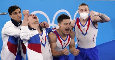 Russian Olympic Committee's artistic gymnastics men's team, from right, Denis Abliazin, Nikita Nagornyy, David Belyavskiy and Artur Dalaloyan, celebrate after winning the gold medal at the 2020 Summer Olympics, Monday, July 26, 2021, in Tokyo. (AP Photo)
