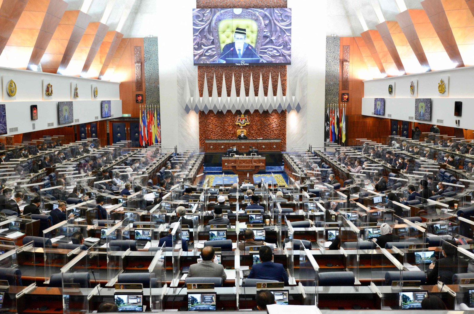 A special session of the Dewan Rakyat (House of Representatives) at the Parliament in Kuala Lumpur, convening for the first time since January after being suspended under a coronavirus emergency, July 26, 2021. (Photo by Nazri RAPAAI / Malaysia's Department of Information / AFP)