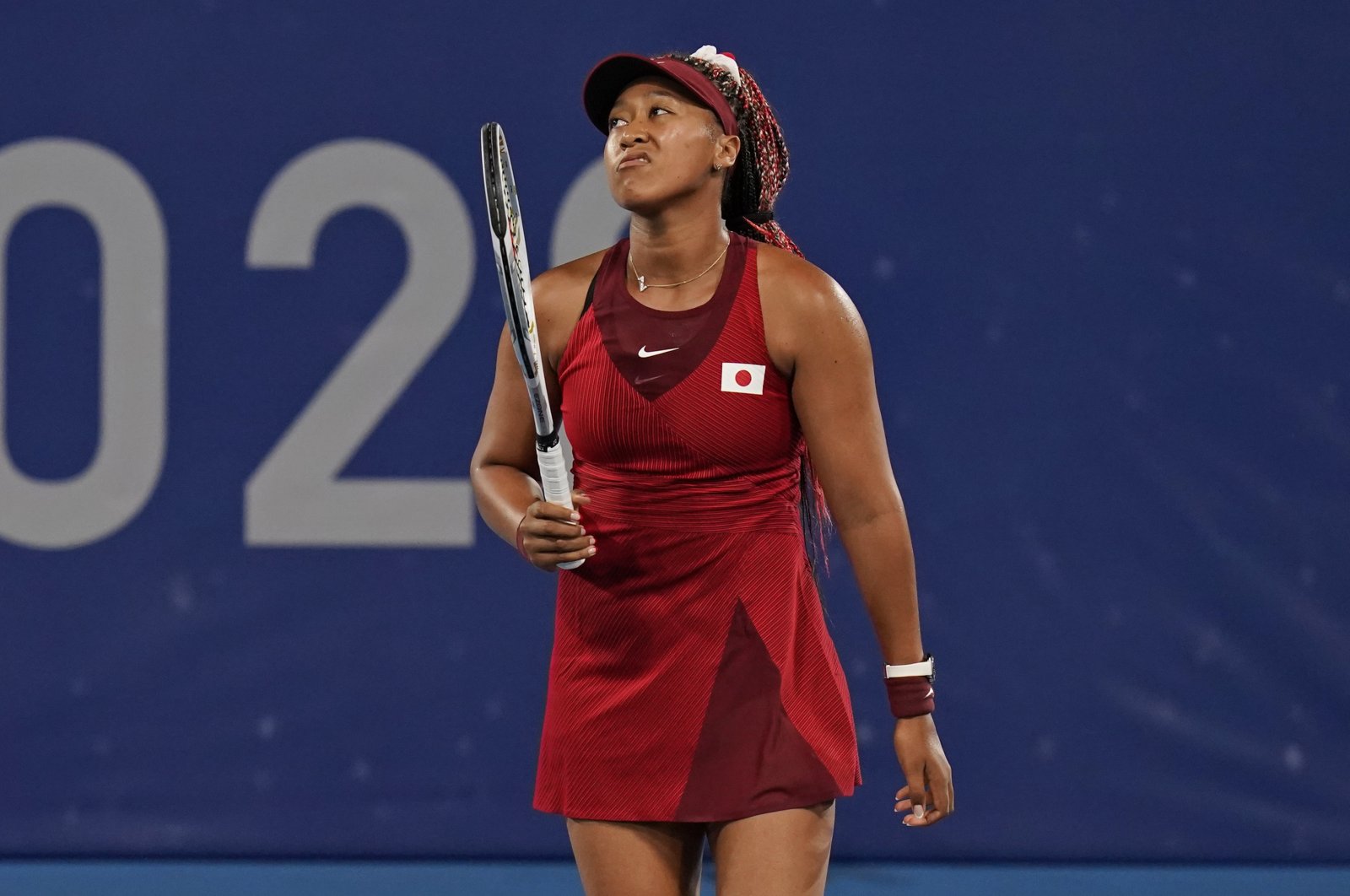 Naomi Osaka, of Japan, reacts after losing a point to Marketa Vondrousova, of the Czech Republic, during the third round of the tennis competition at the 2020 Summer Olympics, in Tokyo, Japan, July 27, 2021. (AP Photo)