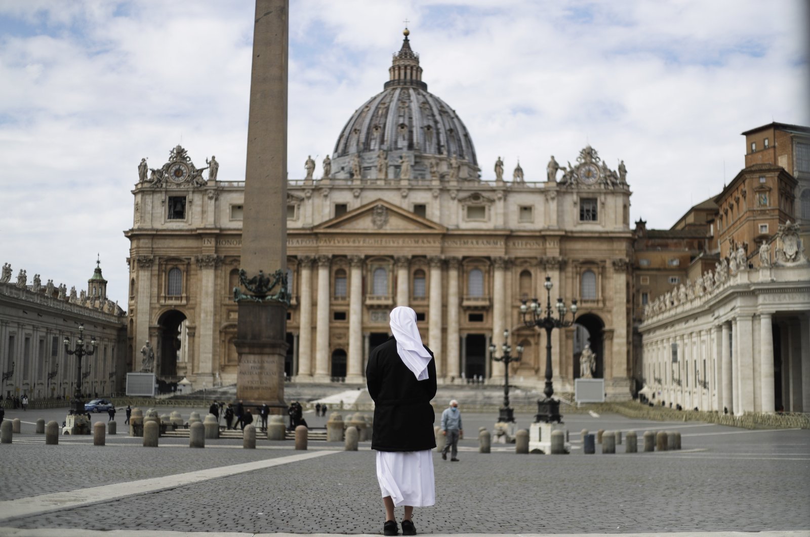 A nun stands in St. Peter's Square at the Vatican, March 21, 2021. (AP Photo)