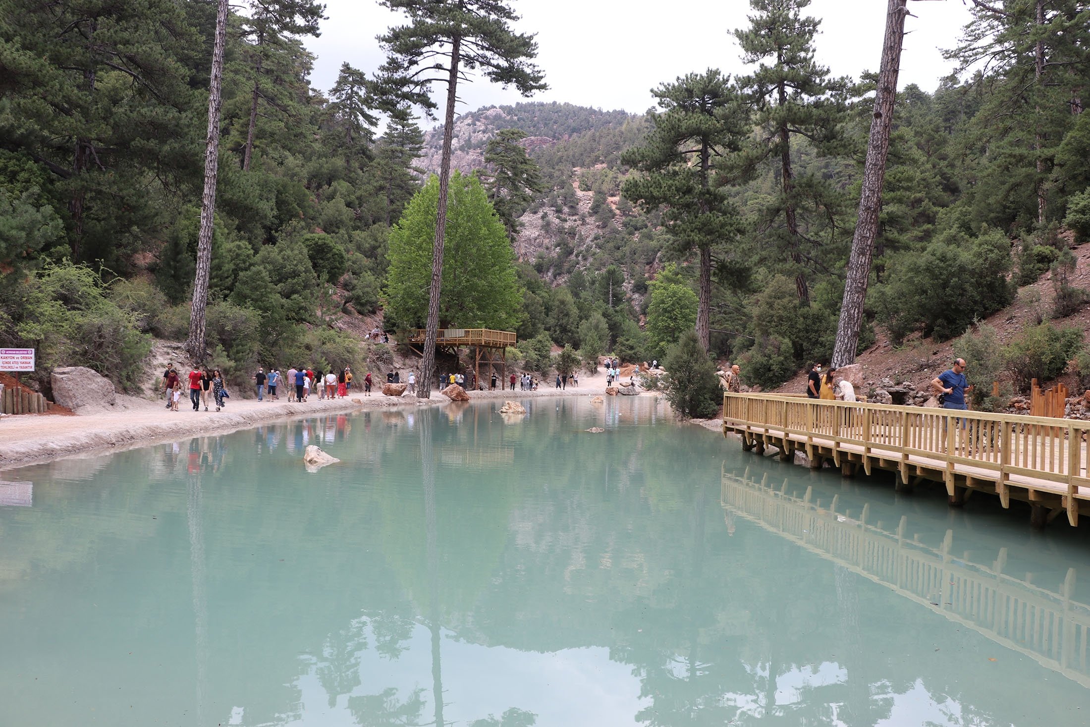 People walk around a pond at the Acıpayam Canyon, Denizli, Turkey, July 25, 2021. (AA Photo)