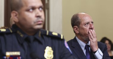 A person reacts as he watches a video from the Jan. 6 insurrection during the House select committee hearing on the Jan. 6 attack on Capitol Hill in Washington, July 27, 2021. (AP Photo)