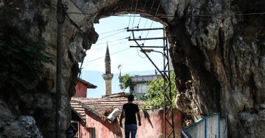 A man walks under the arch of an aqueduct in Hatay, Turkey, July 27, 2021. (AA Photo).